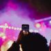 People recording a concert with their phones