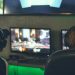 selective focus photography of two persons playing game in front of monitors
